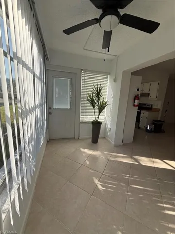 Unfurnished sunroom featuring healthy amount of natural light