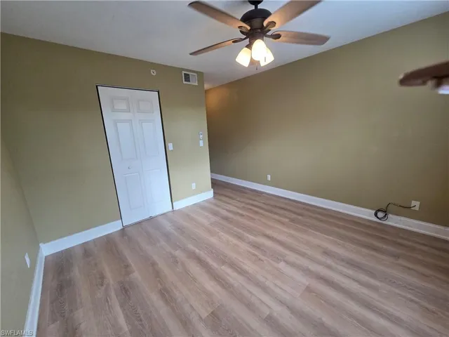 Spare room with light wood-style flooring and a ceiling fan