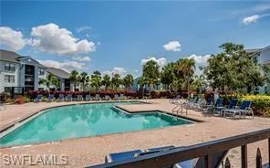 Community pool with a patio