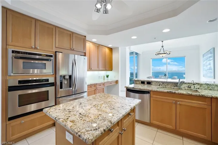 Kitchen featuring stainless steel appliances, sink, plenty of natural light, and a kitchen island
