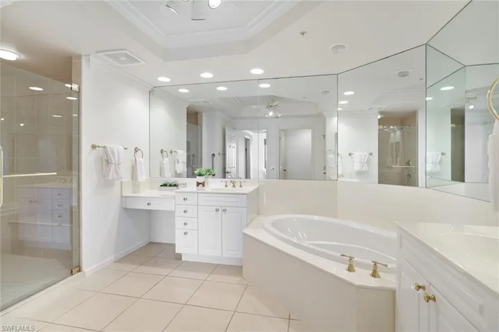 Primary Bathroom with vanity and shower with separate bathtub