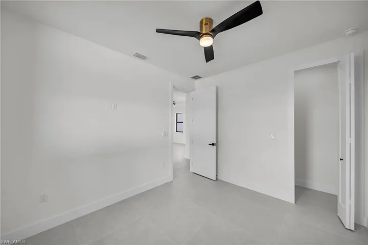 Unfurnished bedroom with ceiling fan