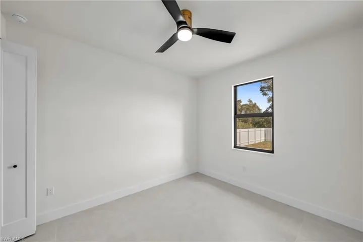 Spare room with ceiling fan