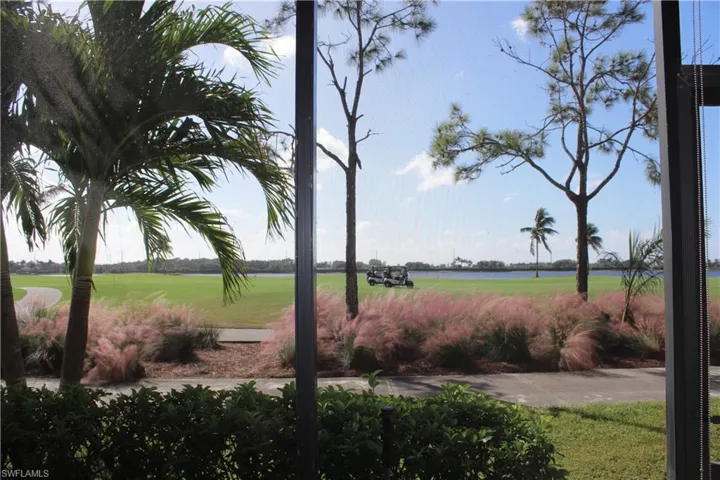 View of property's community featuring a water view and a yard