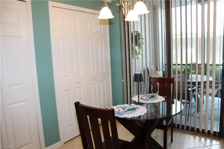 Dining space with tile patterned floors and baseboards