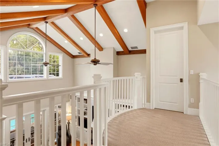 Hallway with recessed lighting, carpet, and beamed ceiling