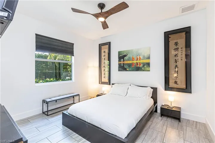 Bedroom featuring baseboards and ceiling fan