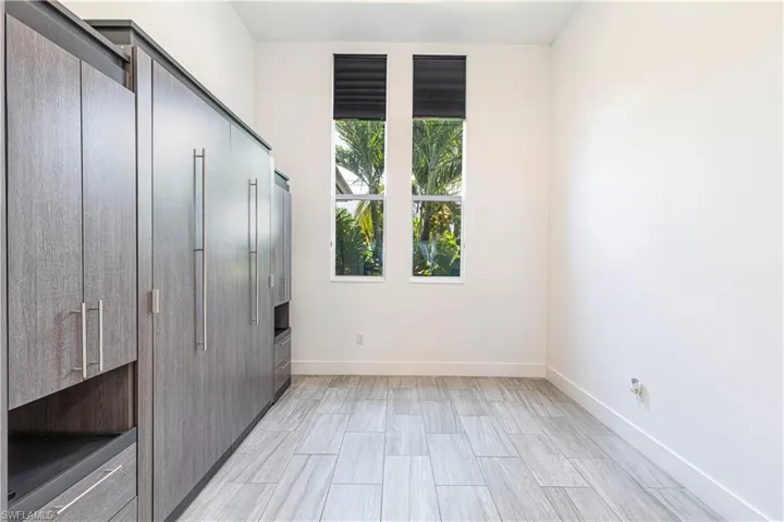 Unfurnished bedroom with baseboards