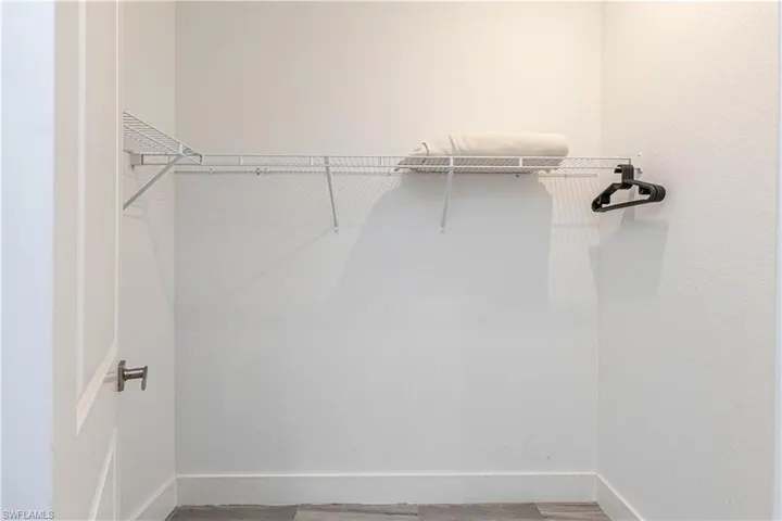 Spacious closet with wood finished floors