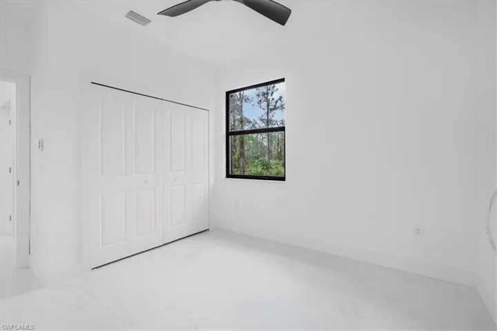 2nd bedroom with closet, and ceiling fan