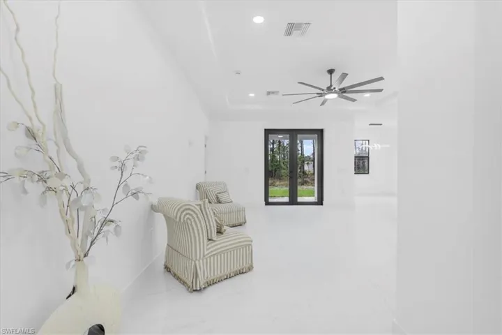 Unfurnished room featuring recessed lighting and a tray ceiling