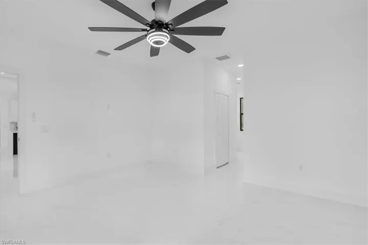 Unfurnished room with recessed lighting, light marble finish flooring, and ceiling fan