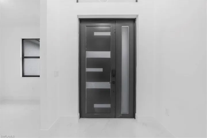 Doorway to property featuring elevator