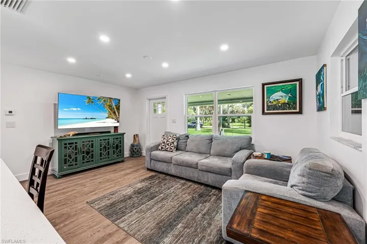 Living room with light wood-type flooring