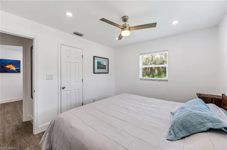 Bedroom with wood-type flooring and ceiling fan
