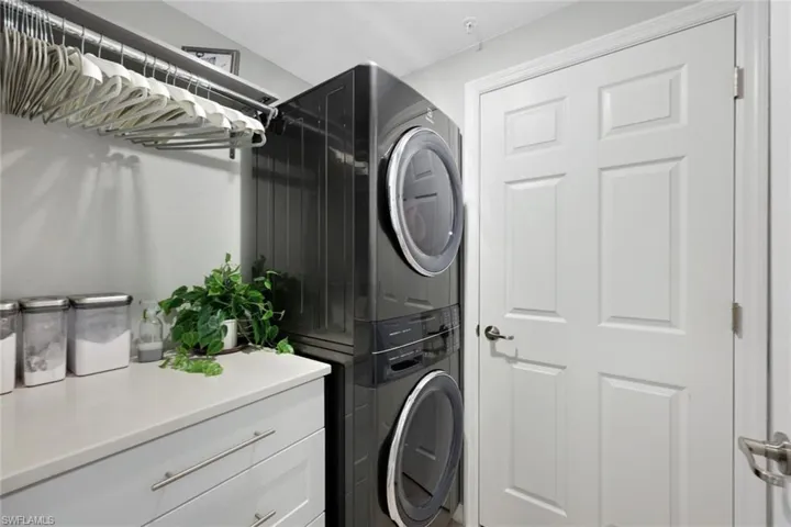Washroom featuring estacked washer and dryer
