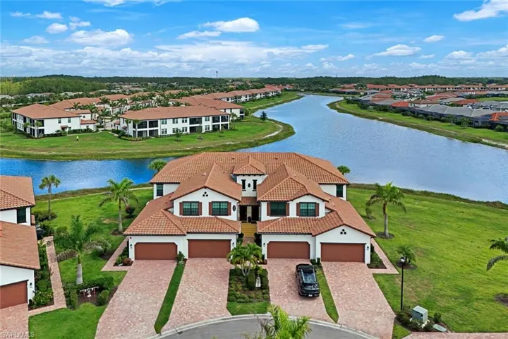 Aerial view of residential area featuring a large body of water
