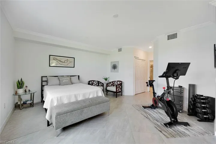 Bedroom featuring crown molding