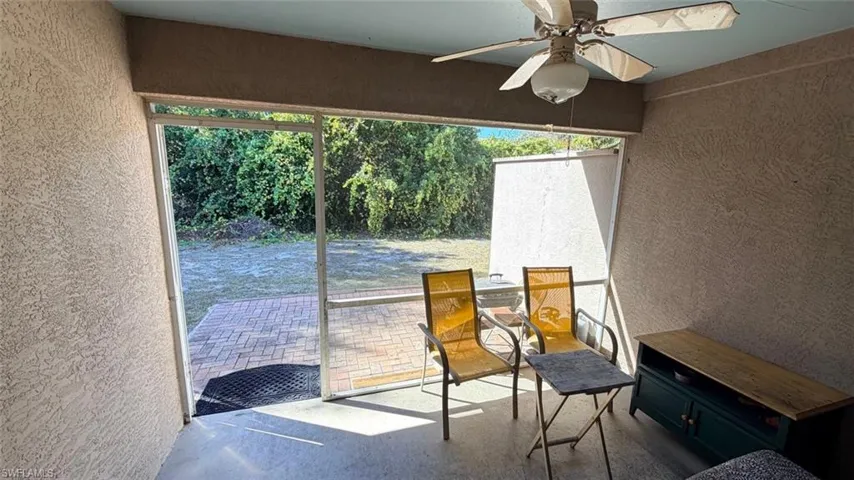 Left Unit: Screened Patio leading to rear yard
