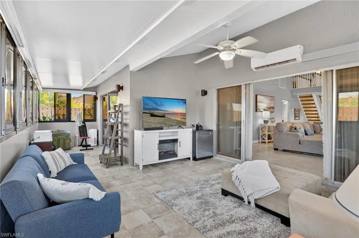 Sunroom / solarium featuring plenty of natural light and beam ceiling