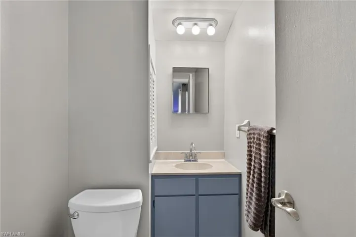 Bathroom with vanity and toilet