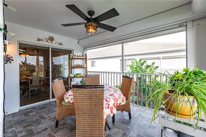 Sunroom featuring a healthy amount of sunlight and ceiling fan