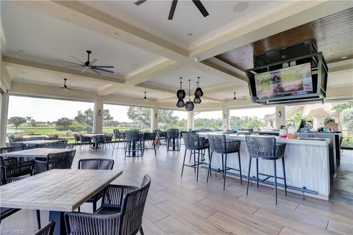 View of patio / terrace with an outdoor bar and ceiling fan