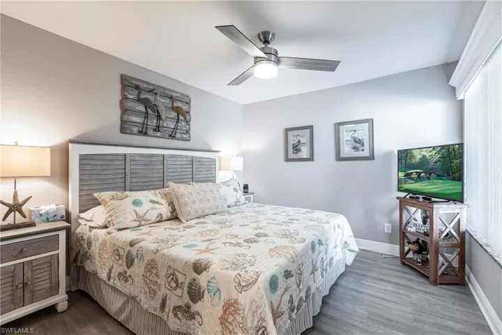 Bedroom featuring hardwood / wood-style floors and ceiling fan