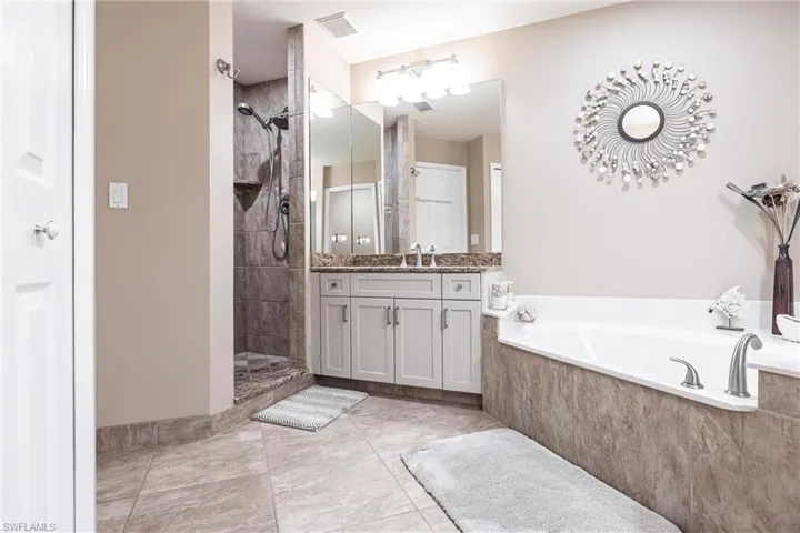 Bathroom with vanity and independent shower and bath