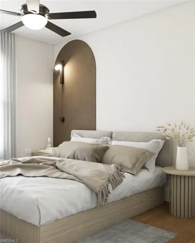 Bedroom with hardwood / wood-style flooring and ceiling fan