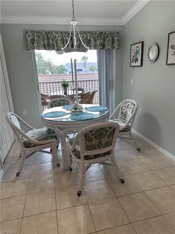 Tiled dining space with ornamental molding