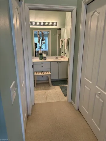Bathroom with tile patterned flooring and vanity