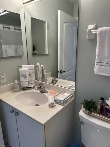 Bathroom with vanity and toilet