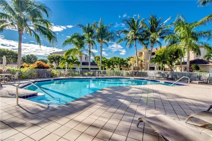 Community pool featuring a patio