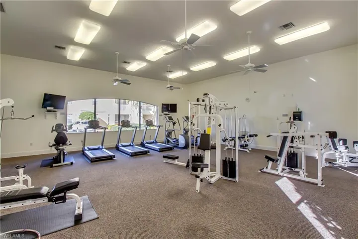 Gym featuring a ceiling fan