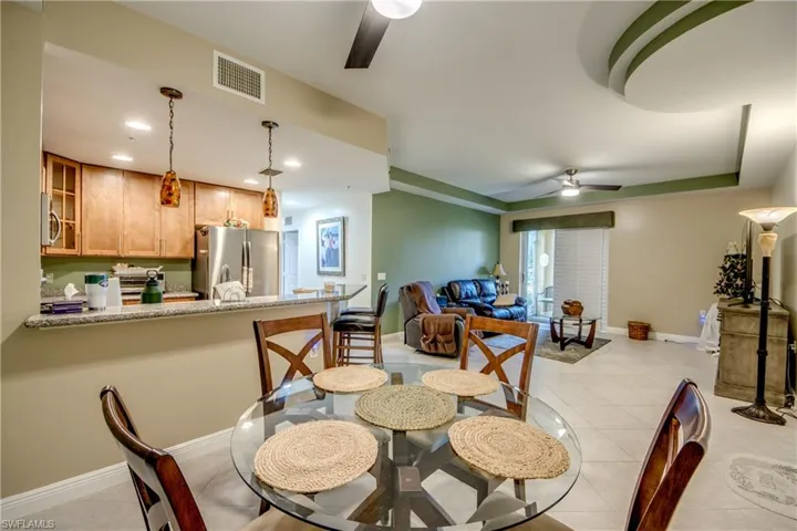 Dining room featuring a ceiling fan and light tile patterned floors