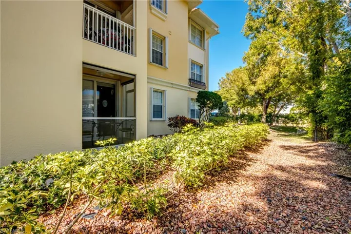 View of yard with a balcony