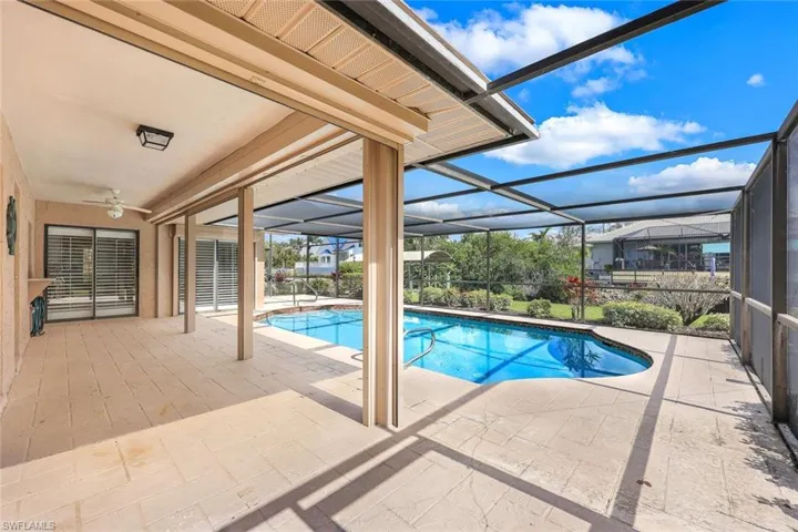 Blending indoor and outdoor living, this spacious patio is ideal for hosting family gatherings, barbecues, or simply unwinding as the sun sets over the water.