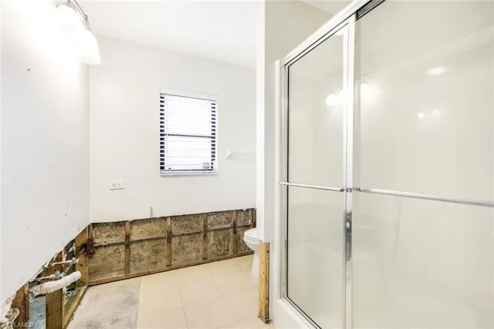 Guest bathroom features a walk-in shower.