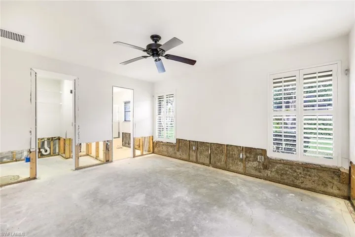 Primary bedroom offers his and her bathroom.