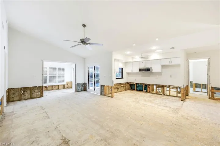 Living room and kitchen are open to one another.