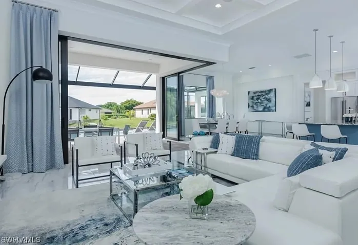 Living room featuring coffered ceiling, beam ceiling, and recessed lighting