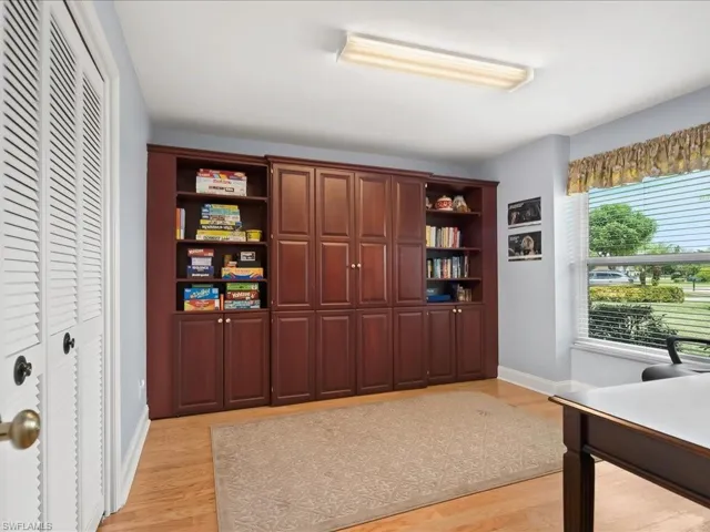 The third bedroom has a built-in Murphy bed system with bookcases on either side, double closets and a large hurricane rated window.