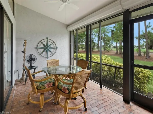 Lanai is screened with ceiling fan.