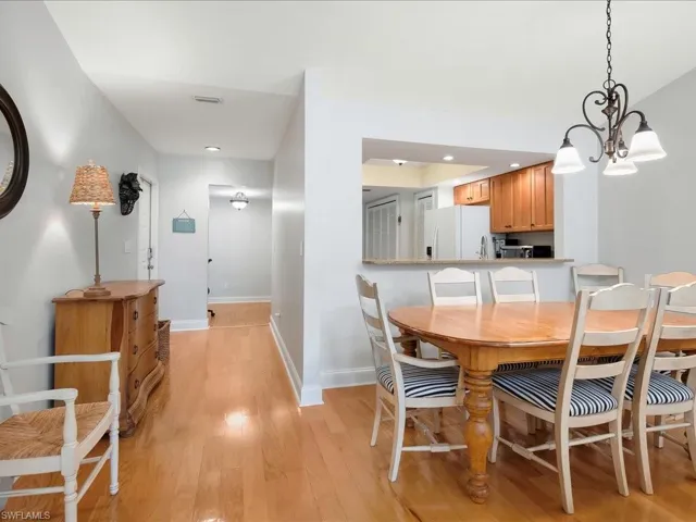 Dining area looking back to kitchen and foyer.