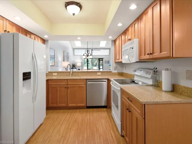 Kitchen with updated cabinets, granite counters.