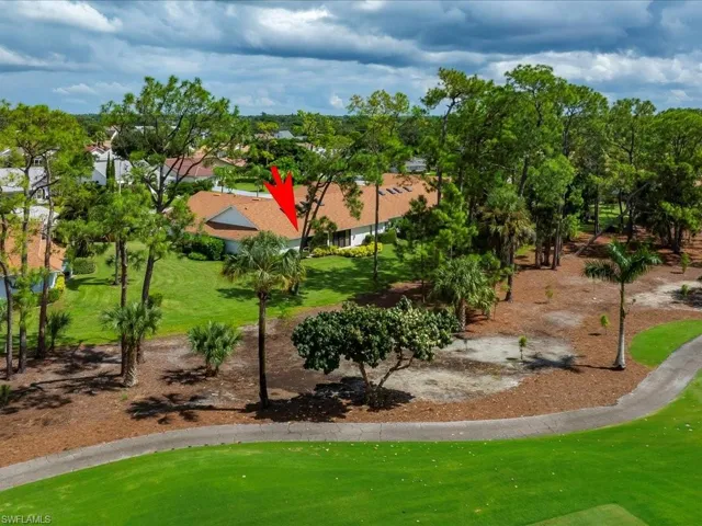 View of back yard and part of golf course.