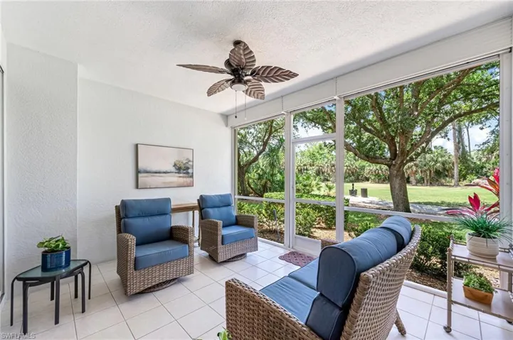 Sunroom / solarium with a ceiling fan