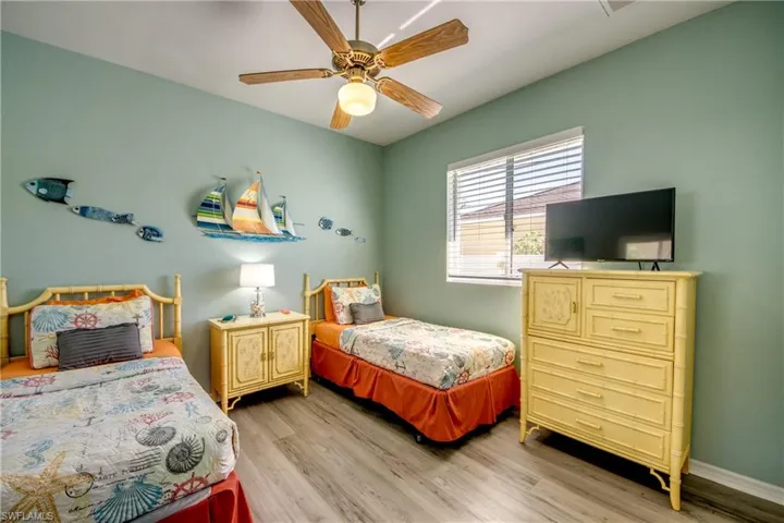 Bedroom with wood-type flooring and ceiling fan
