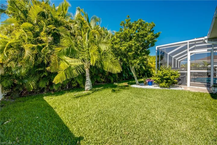 View of yard with a lanai